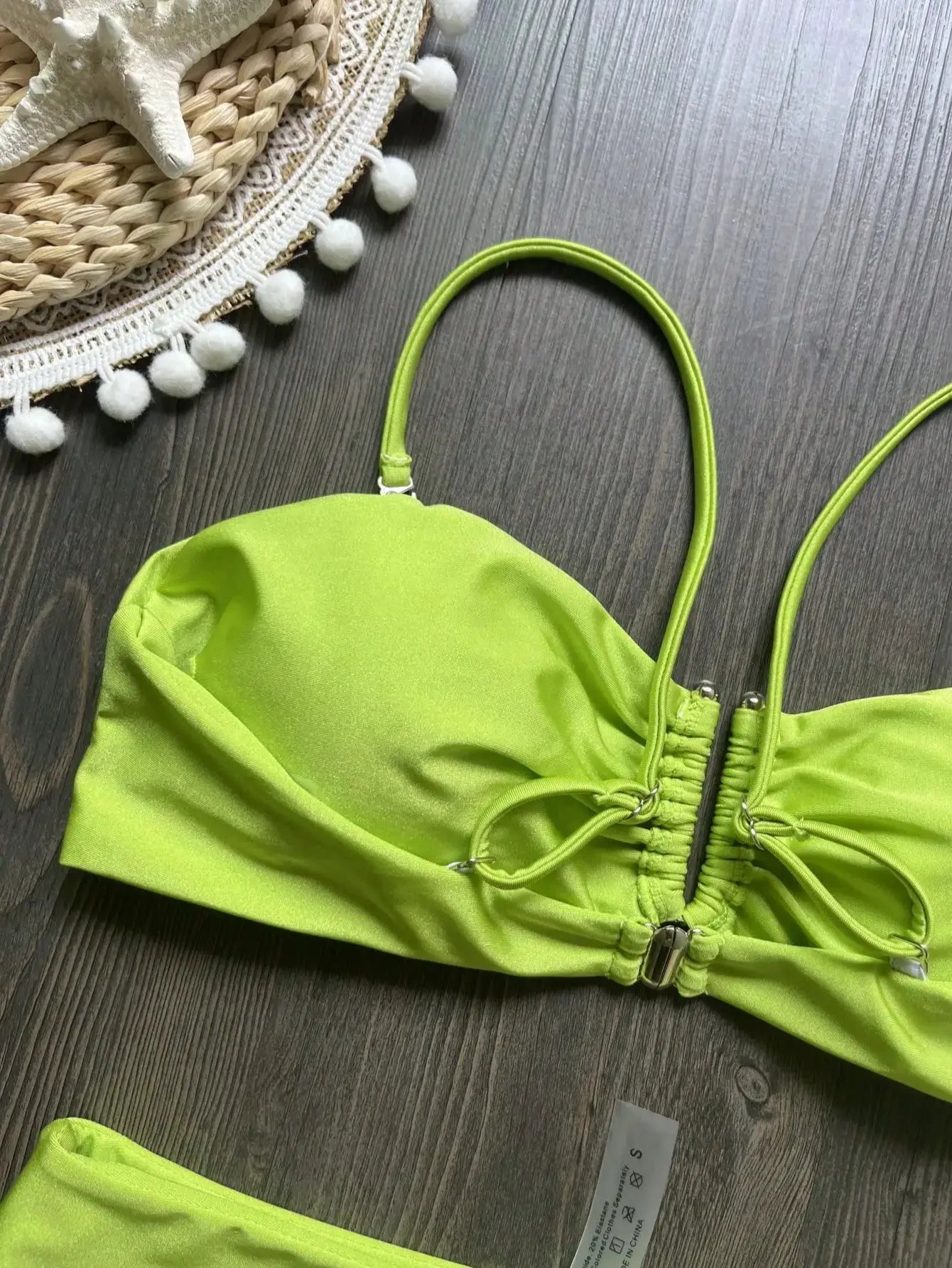 Bandeau bikini top in neon lime green with ruched center and adjustable straps
