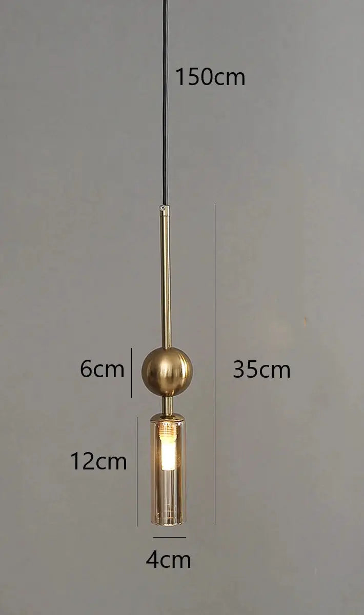 Nordic Light Luxury Pendant Light by Simples Market in gold and black iron with a glass shade.