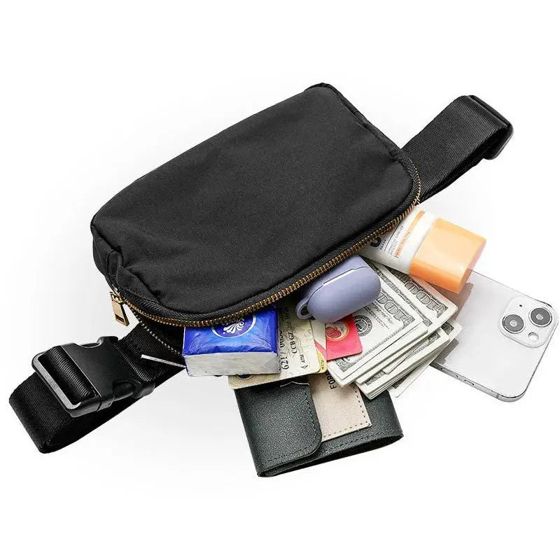 Simples Market black waist bag with zipper and adjustable strap, cash, phone and cards visible.