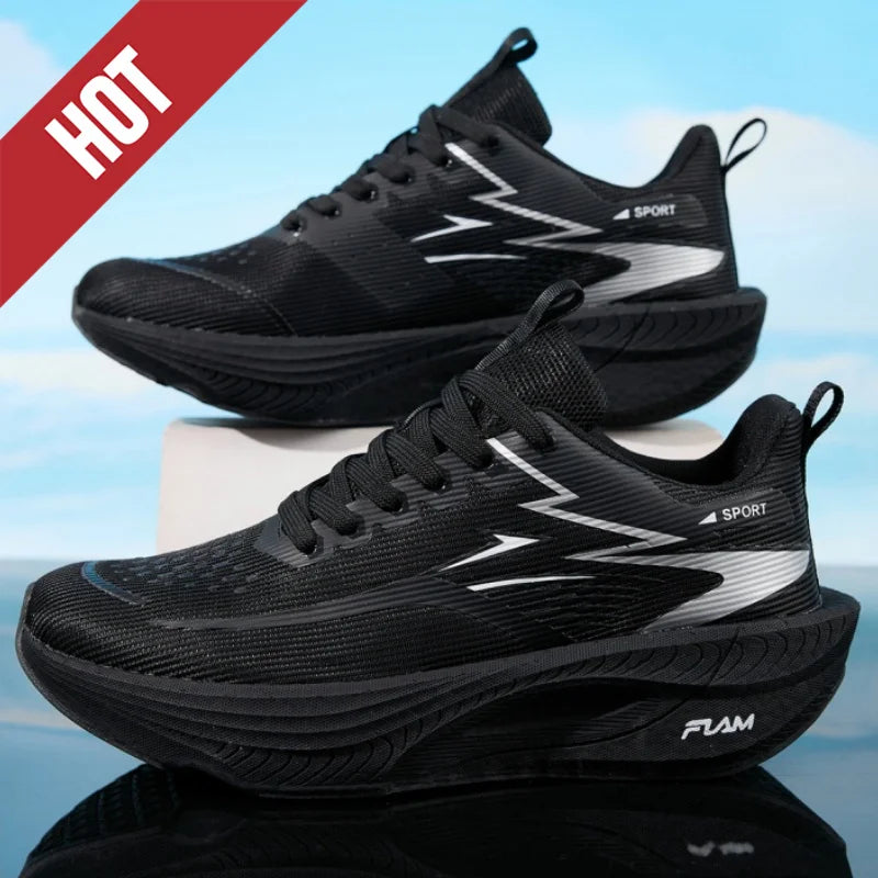 Pair of black mesh running sneakers with white zigzag accents, thick cushioned sole, ideal for jogging and workouts