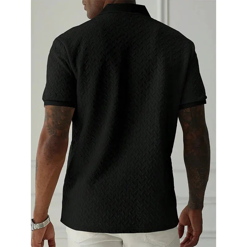 Men's black polo shirt with a subtle textured pattern, short sleeves