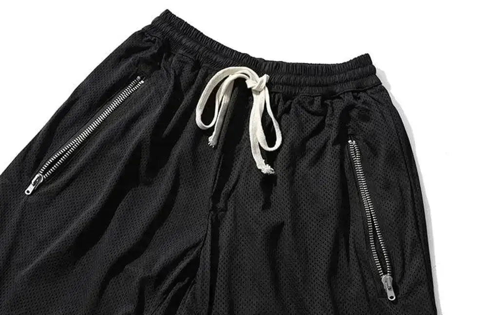Men's black mesh basketball shorts with quick-dry fabric, side zip pockets and drawstring