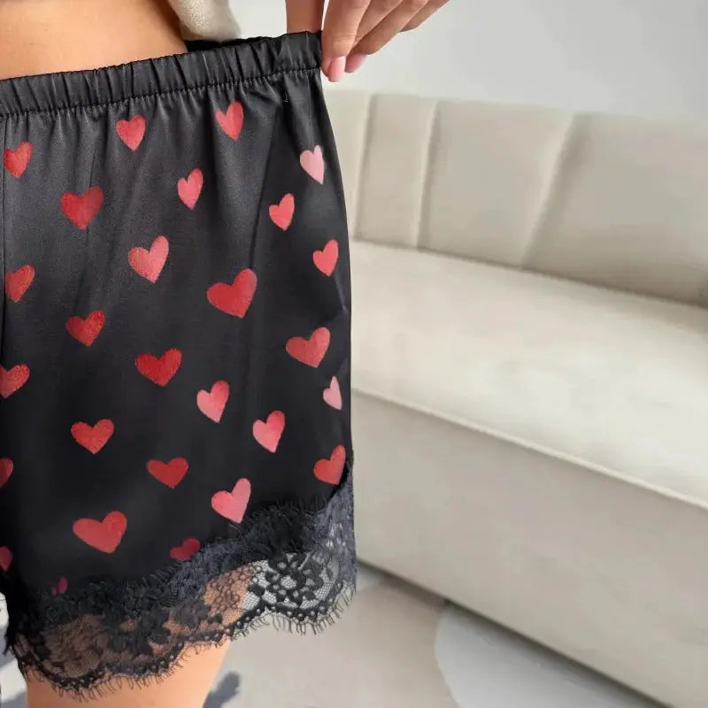 Women's black heart-print satin shorts by Simples Market with elastic waist and lace-trimmed hem