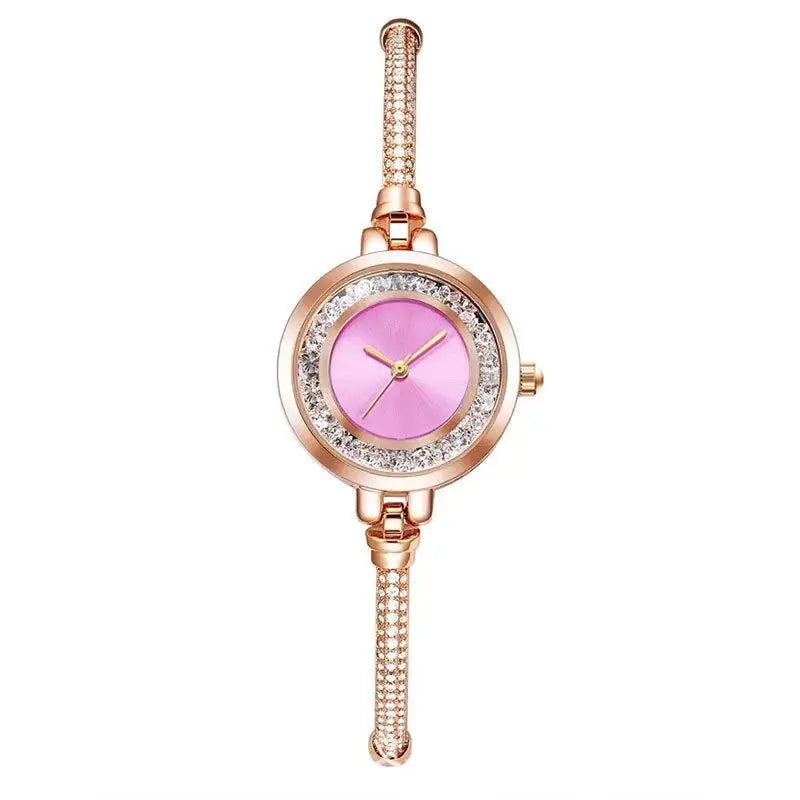 Women's rose-gold wristwatch with pink dial, crystal-studded bezel, and jeweled bracelet by Simples Market