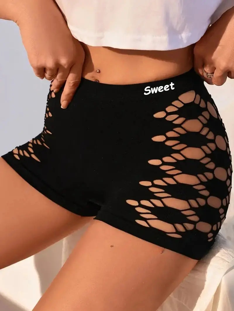 Seamless high-waisted black shorts with side lattice mesh cutouts