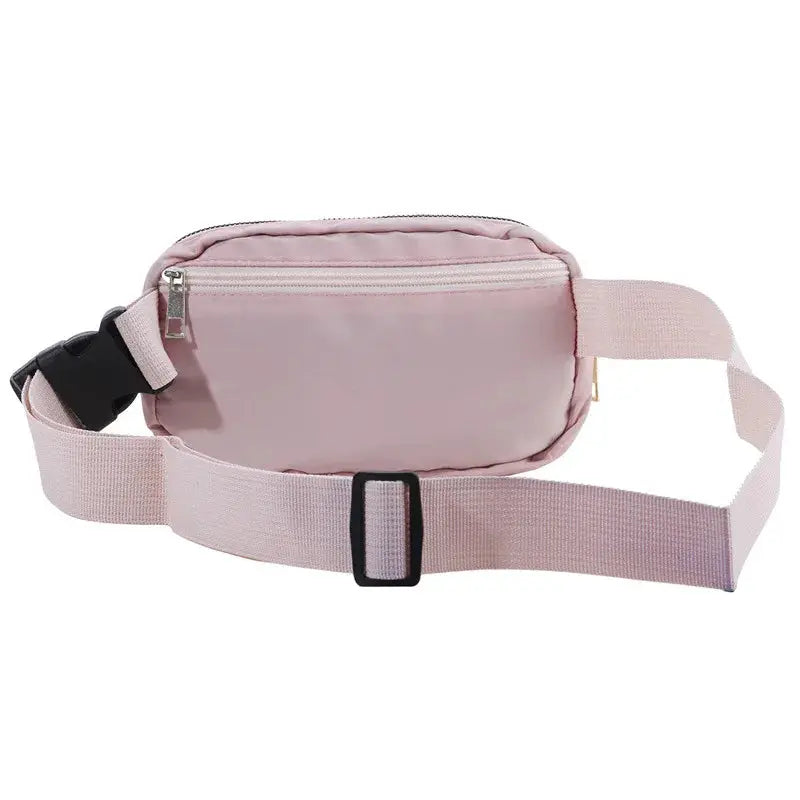 Pink waist bag with adjustable strap and front zipper pocket by Simples Market.