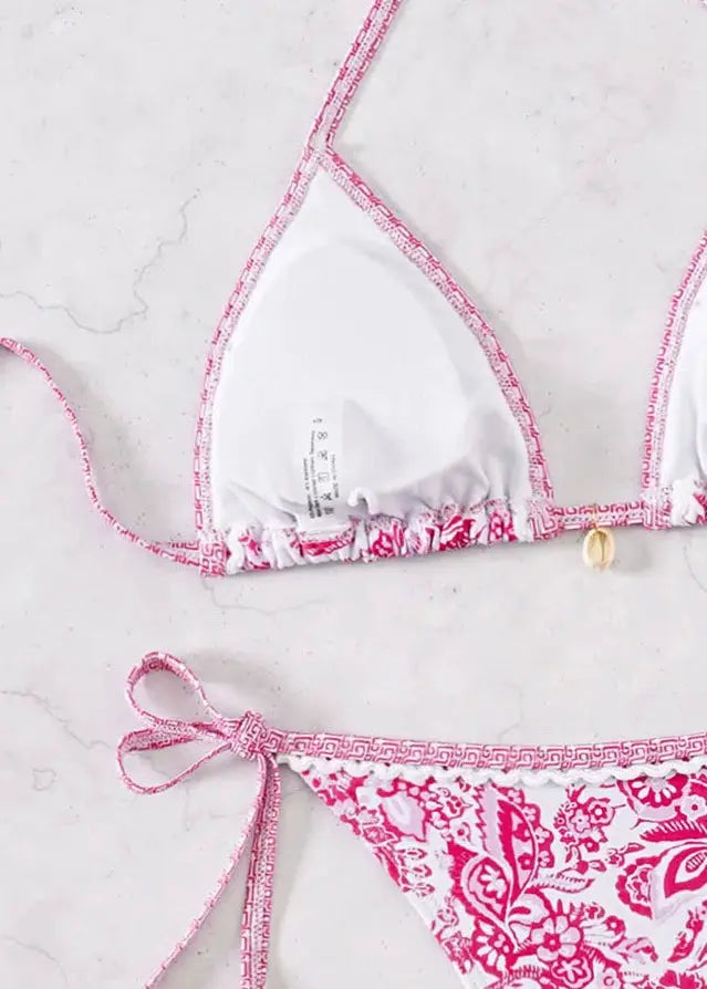 Simples Market triangle bikini set with white push-up top and pink floral-print Brazilian bottoms.