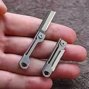 1pc stainless steel mini folding knife by Simples Market, a multi-function pocket tool keychain