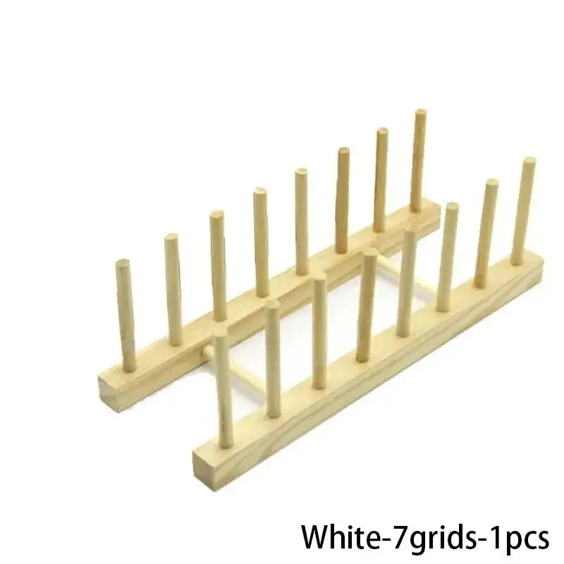 Wooden dish drying rack with peg-style supports and drainboard for kitchen storage by Simples Market