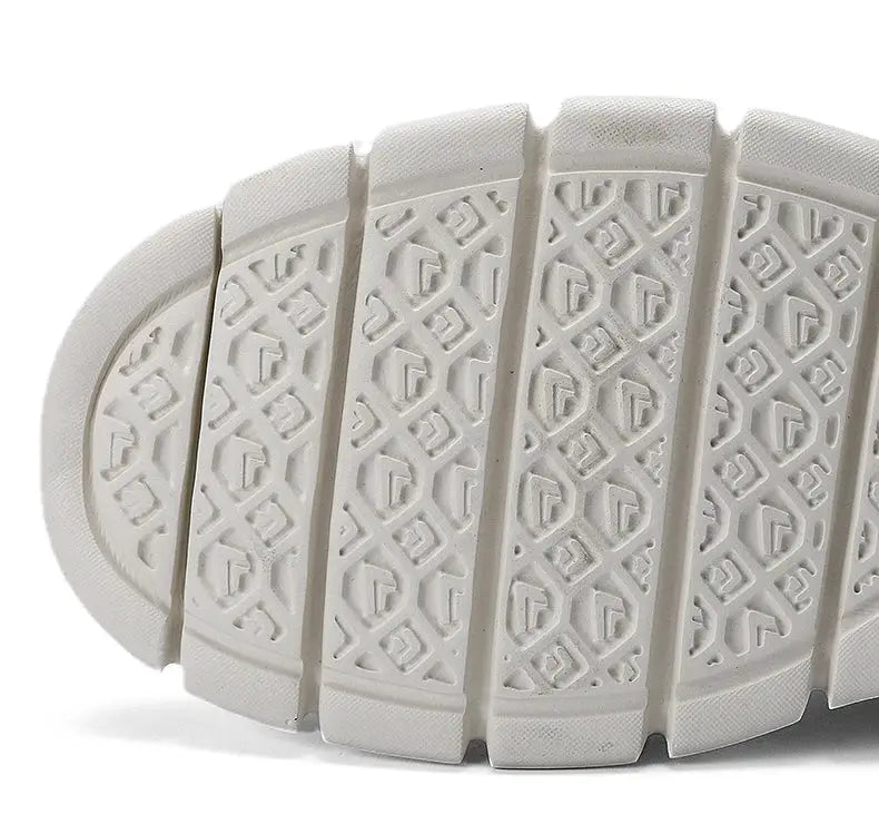 Bottom view of white men's mesh casual shoes; breathable, lightweight non-leather loafers for plus sizes 50–54.