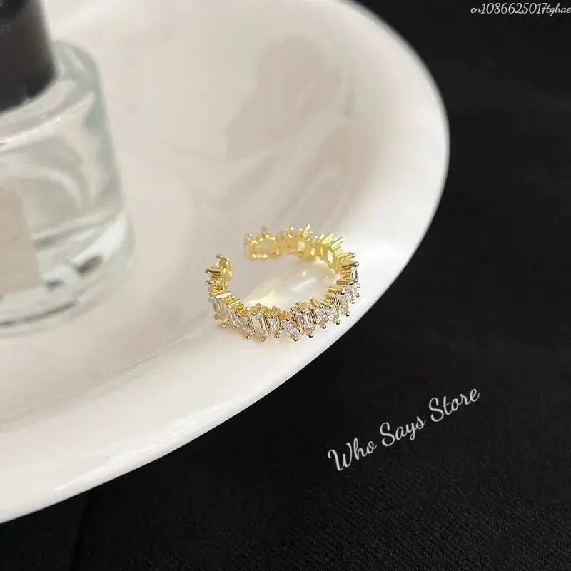 MoonBIFFY zircon ring for women, gold-tone stainless steel with sparkling baguette-cut zircon stones