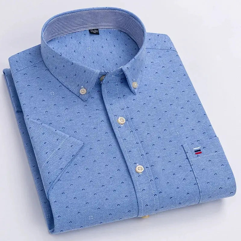 Oxford shirt by Simples Market; light-blue 100% cotton with subtle navy dots and chest pocket flag logo