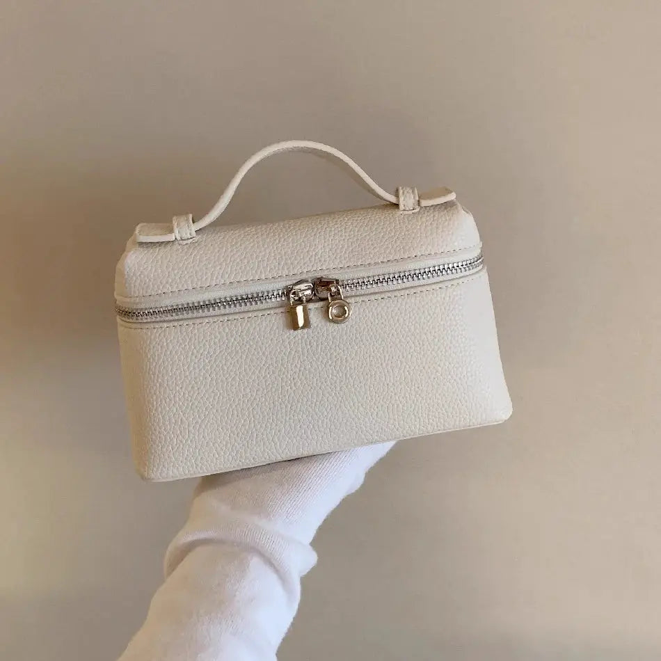 Lychee-grain mini white shoulder bag by Simples Market with top handle and silver zipper