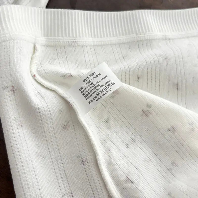 White women's underwear fabric with tag, mid-waist breathable knit panty