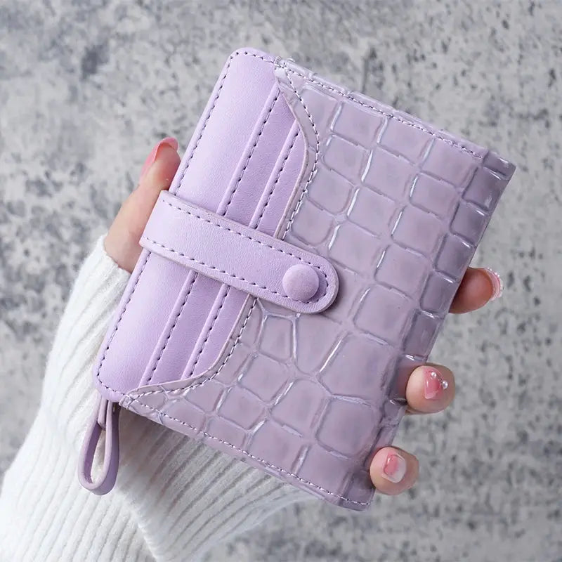 Mini crocodile-print lavender clutch wallet with strap and card slots