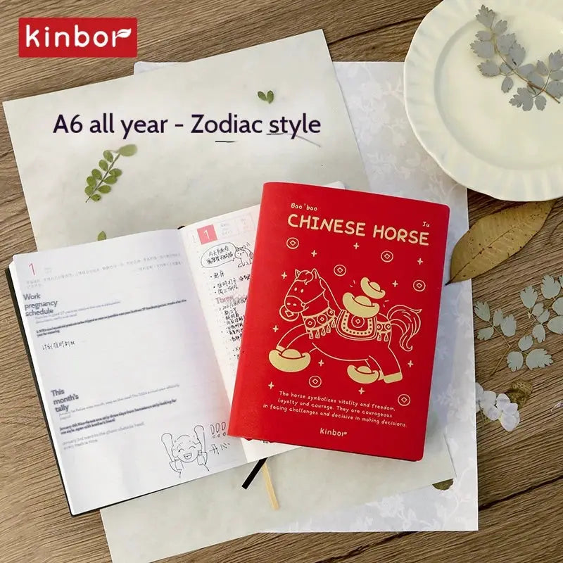 Kinbor notebook planner set; two items: red Chinese Horse pocket planner and white A6 all-year zodiac calendar sheet