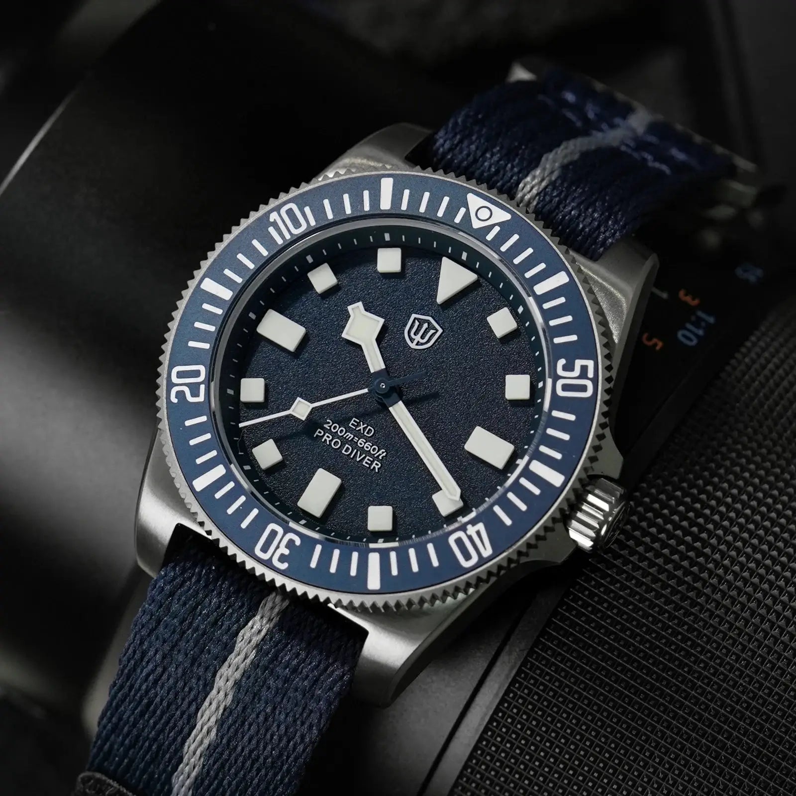 EXD 40mm titanium dive watch with blue bezel and dial, white luminous indices, fabric strap