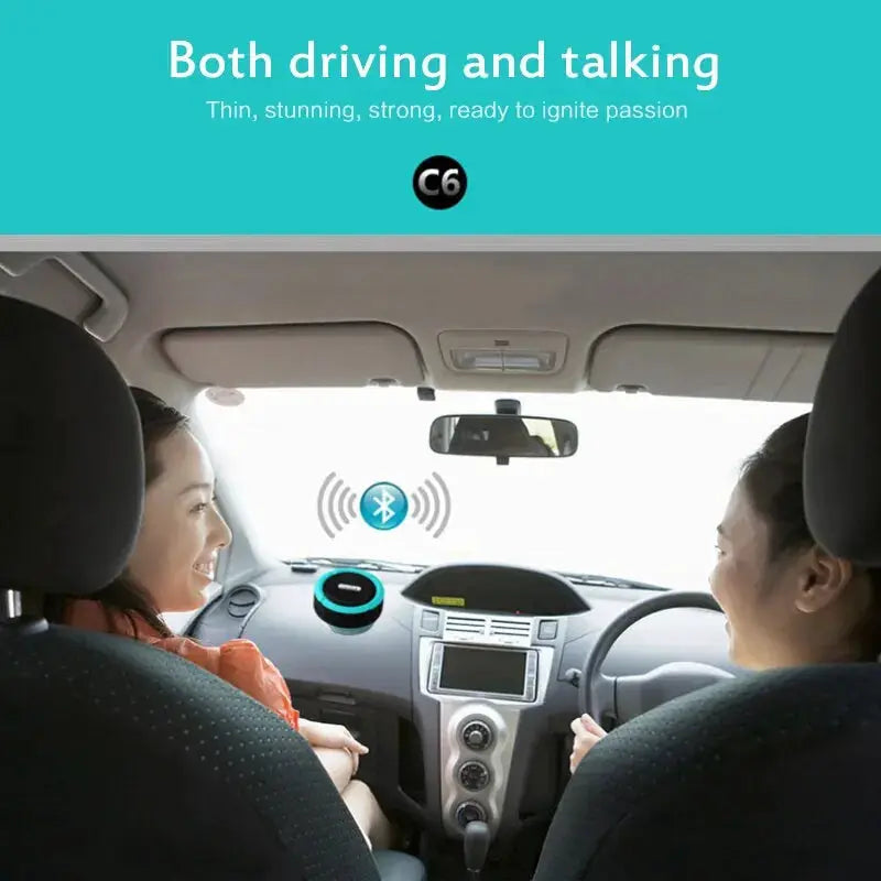 Waterproof wireless Bluetooth speaker on a car dashboard with turquoise ring, two people smiling in the front seats.