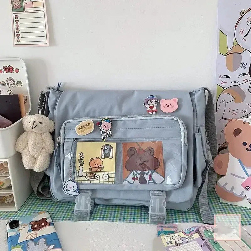 Simples Market large-capacity crossbody canvas bag in light blue with front pocket and patches