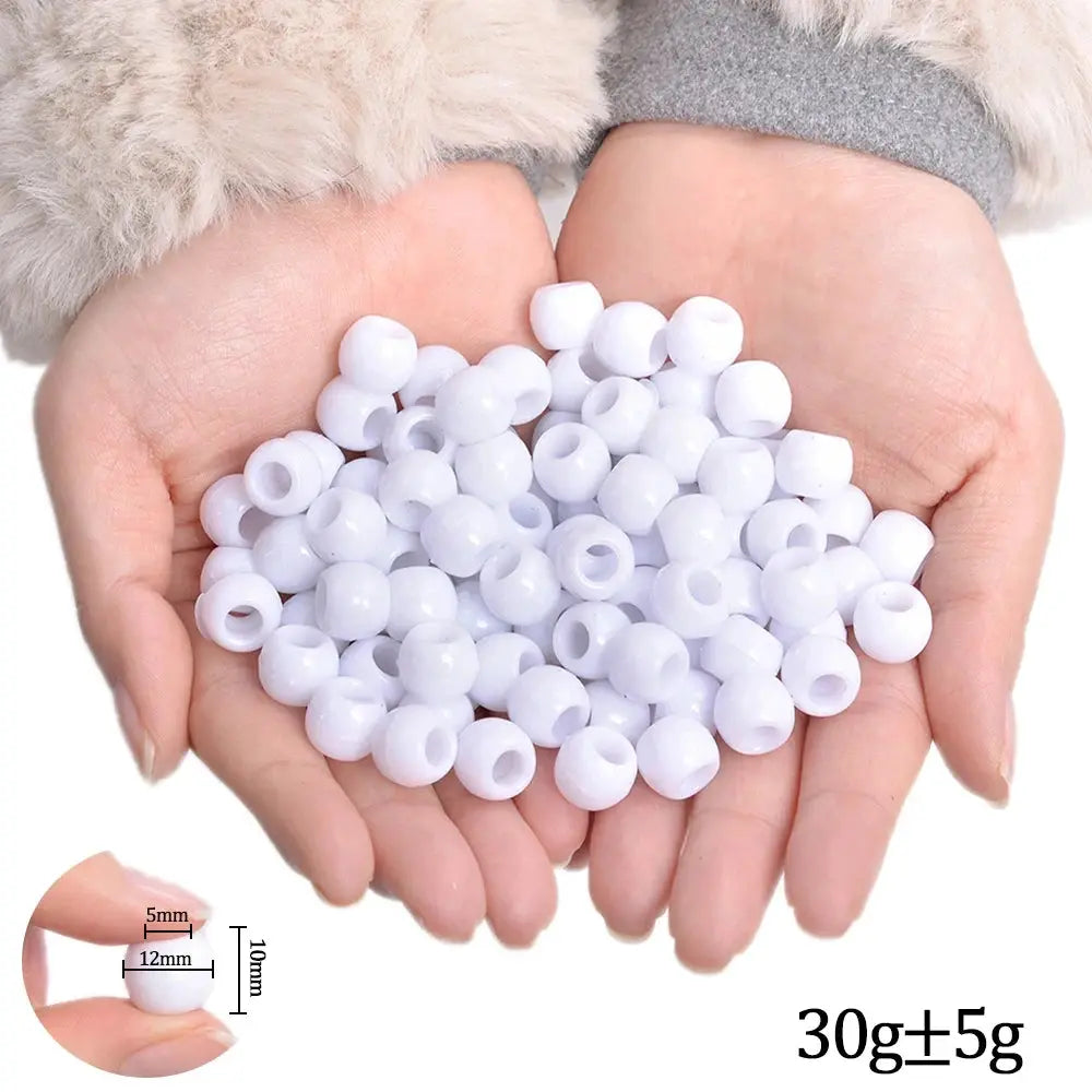White plastic hair braiding beads held in hands; lightweight, total 30g±5g, for braiding hair extensions