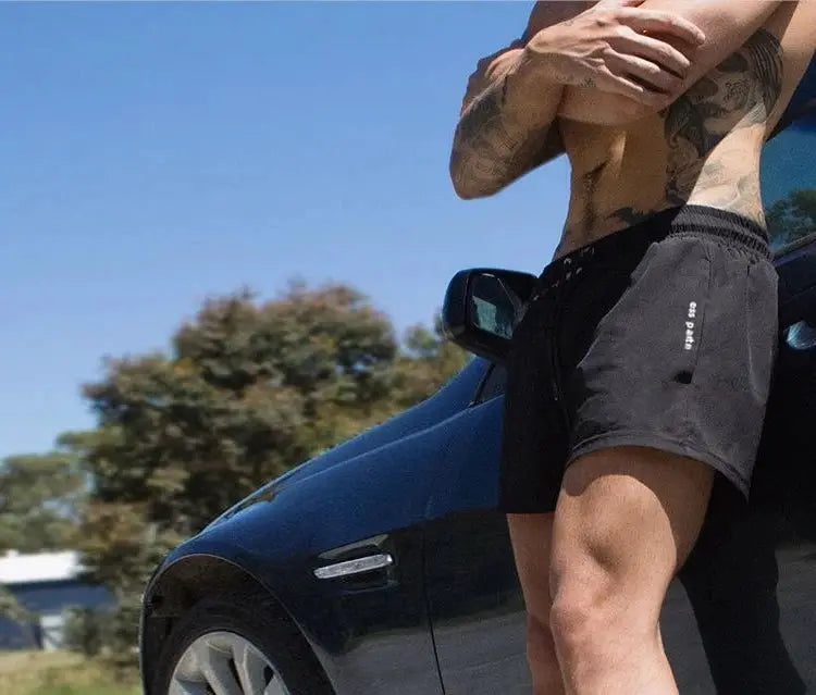 Men's black lightweight gym shorts with drawstring, quick-drying fabric by Simples Market.