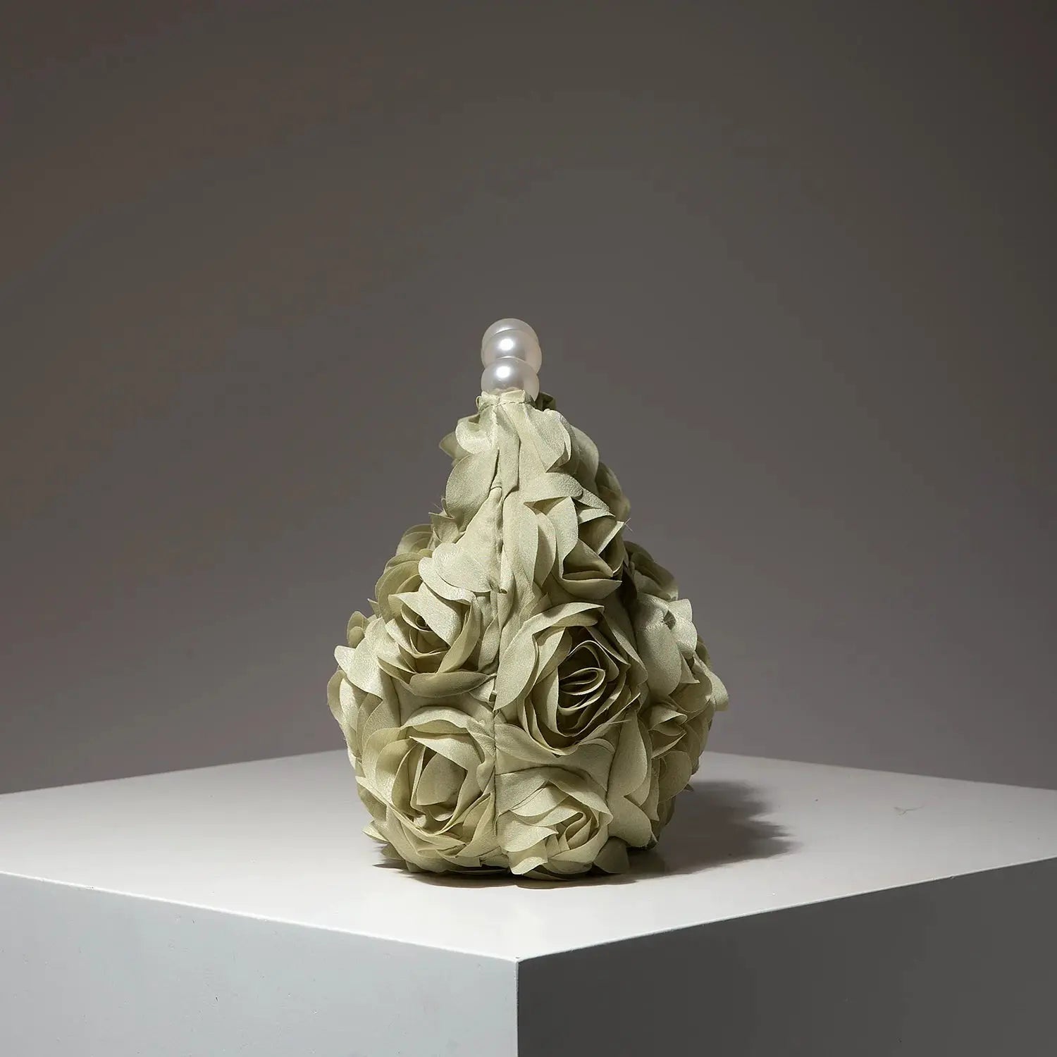 Cream floral-rose clutch bag featuring a pearl bead top handle, elegant gala accessory