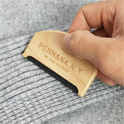 Wooden sweater lint remover by Penn&K.N.Y; handheld fabric shaver with black comb