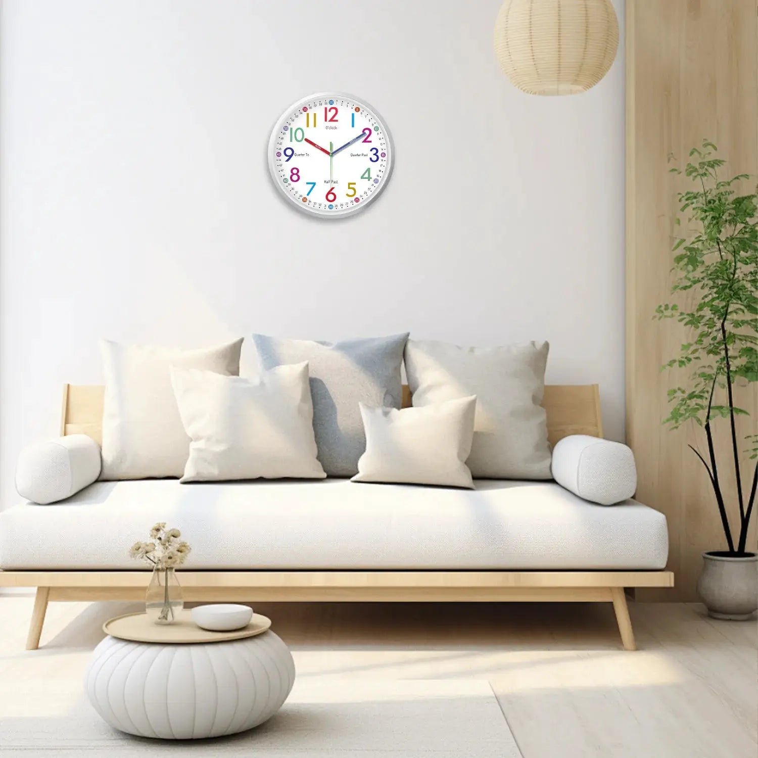 8-inch modern minimalist plastic wall clock with colorful numerals mounted on a white wall in a bright living room.