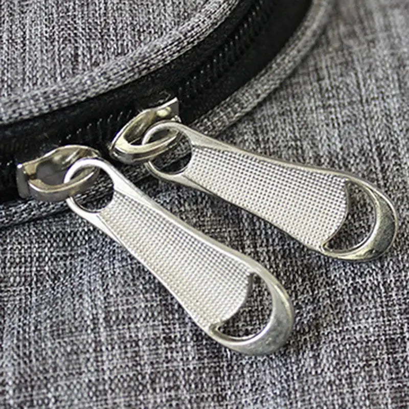 Oxford waterproof travel bag with dual silver zipper pulls on grey fabric