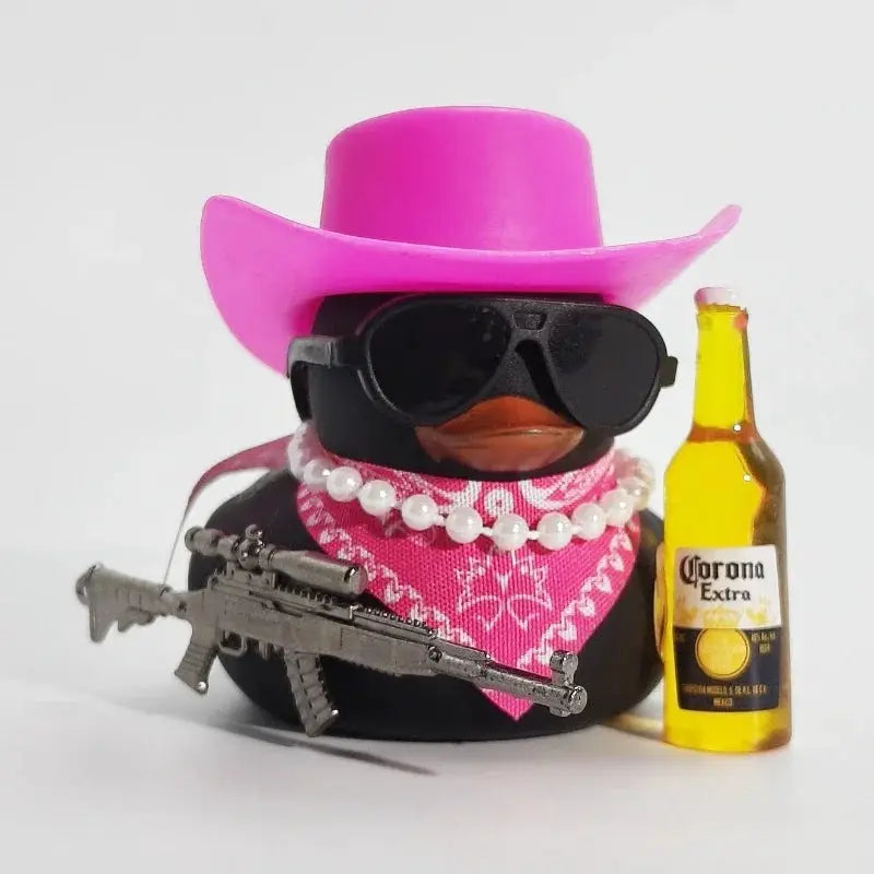 Cowboy Rubber Duck car ornament by Simples Market; pink hat, black sunglasses, pink bandana, pearl necklace, gun