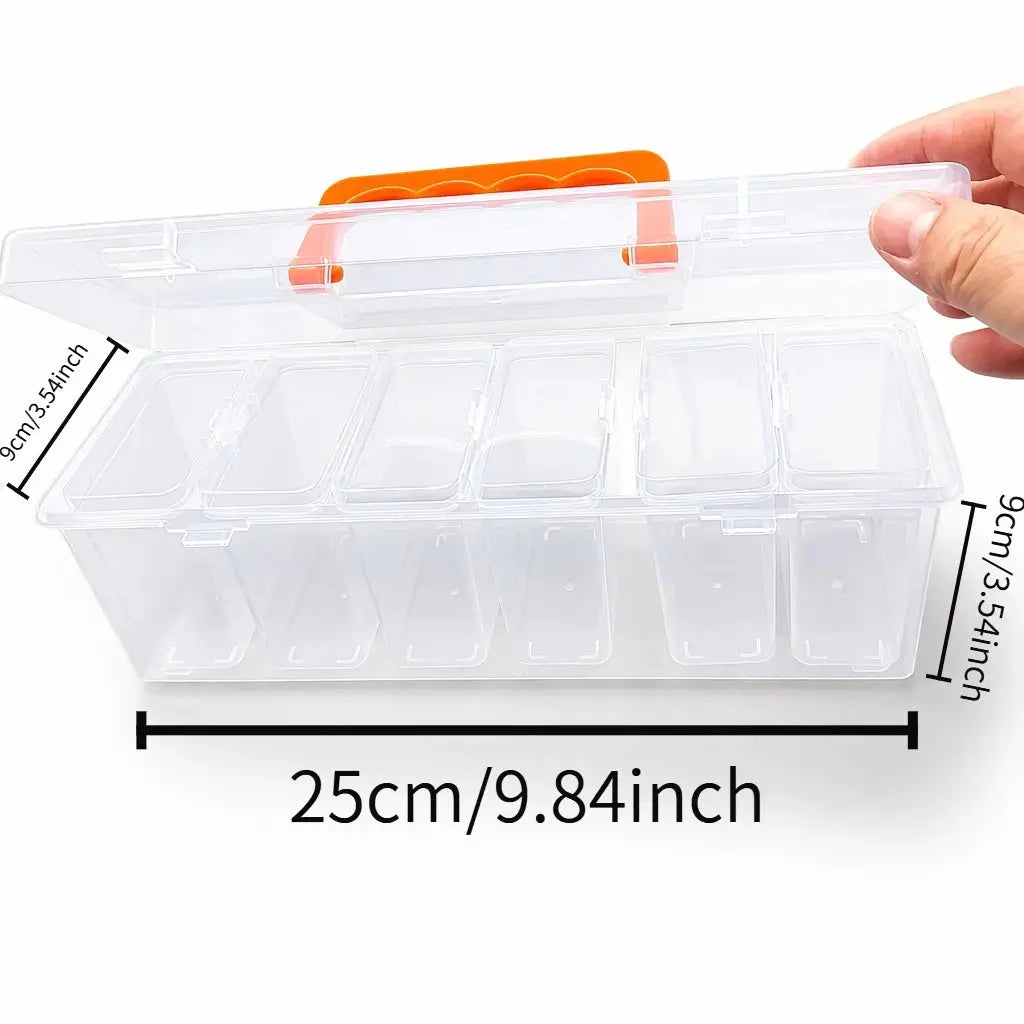 Clear plastic multi-compartment tool storage box with orange latch, divided for screws and small hardware; 25 cm long.