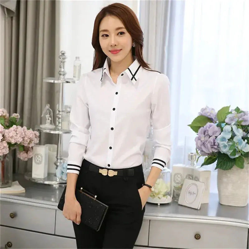 White women's long-sleeve office blouse with black collar trim by Simples Market