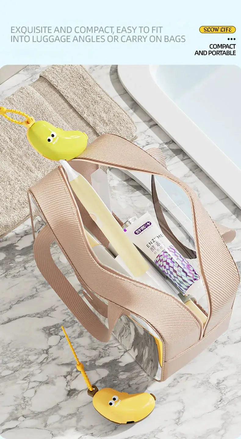 Banana toothbrush protective cap with toothpaste storage in beige travel bag; yellow cap attached.