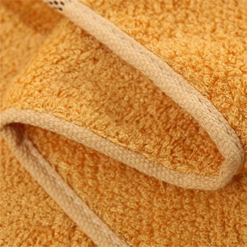 Set of 2 bamboo fiber bath towels in warm orange with beige edging