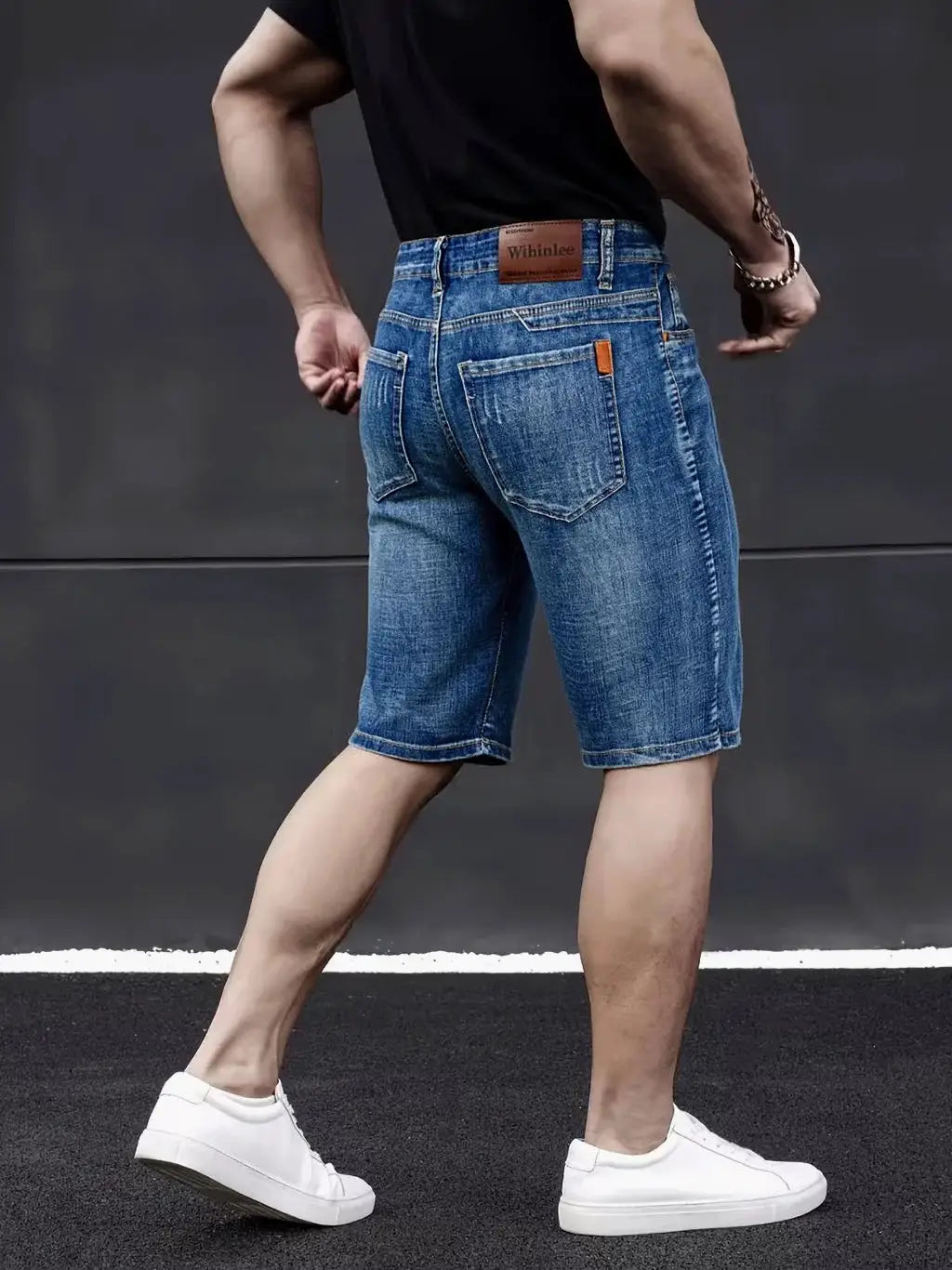 Wthinlee men's denim knee-length shorts in blue, back view with brown patch logo and rear pockets