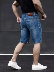 Wthinlee men's denim knee-length shorts in blue, back view with brown patch logo and rear pockets