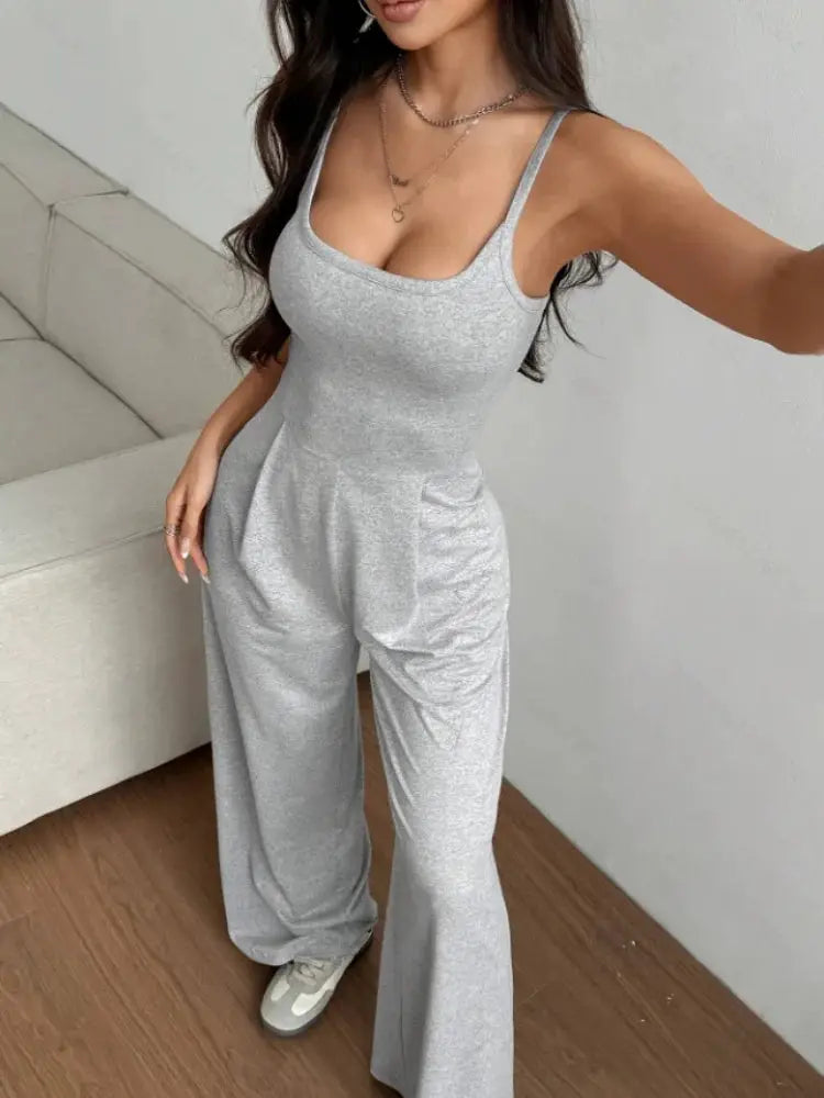 Women's gray halter jumpsuit with sleeveless top and wide-leg floor-length trousers