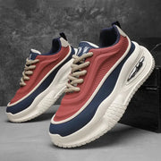 Men's casual sports shoes with thick white sole, red and navy panels, pair of skate sneakers
