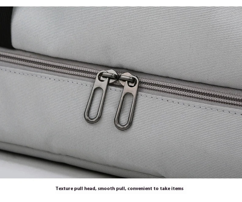 Large capacity travel gym bag in gray with dual zippers and water-resistant fabric.