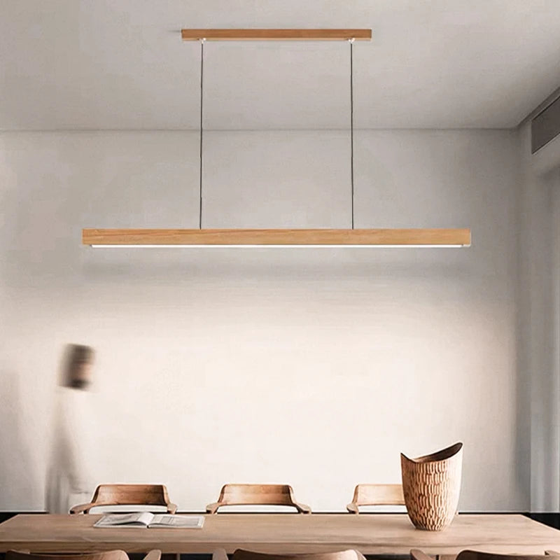 DAMIASMIL LED Pendant Light, natural wood long strip suspended over a modern dining table