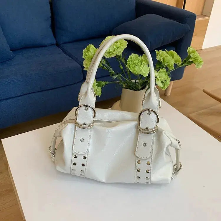 White PU leather rivet shoulder bag with dual top handles and studded straps