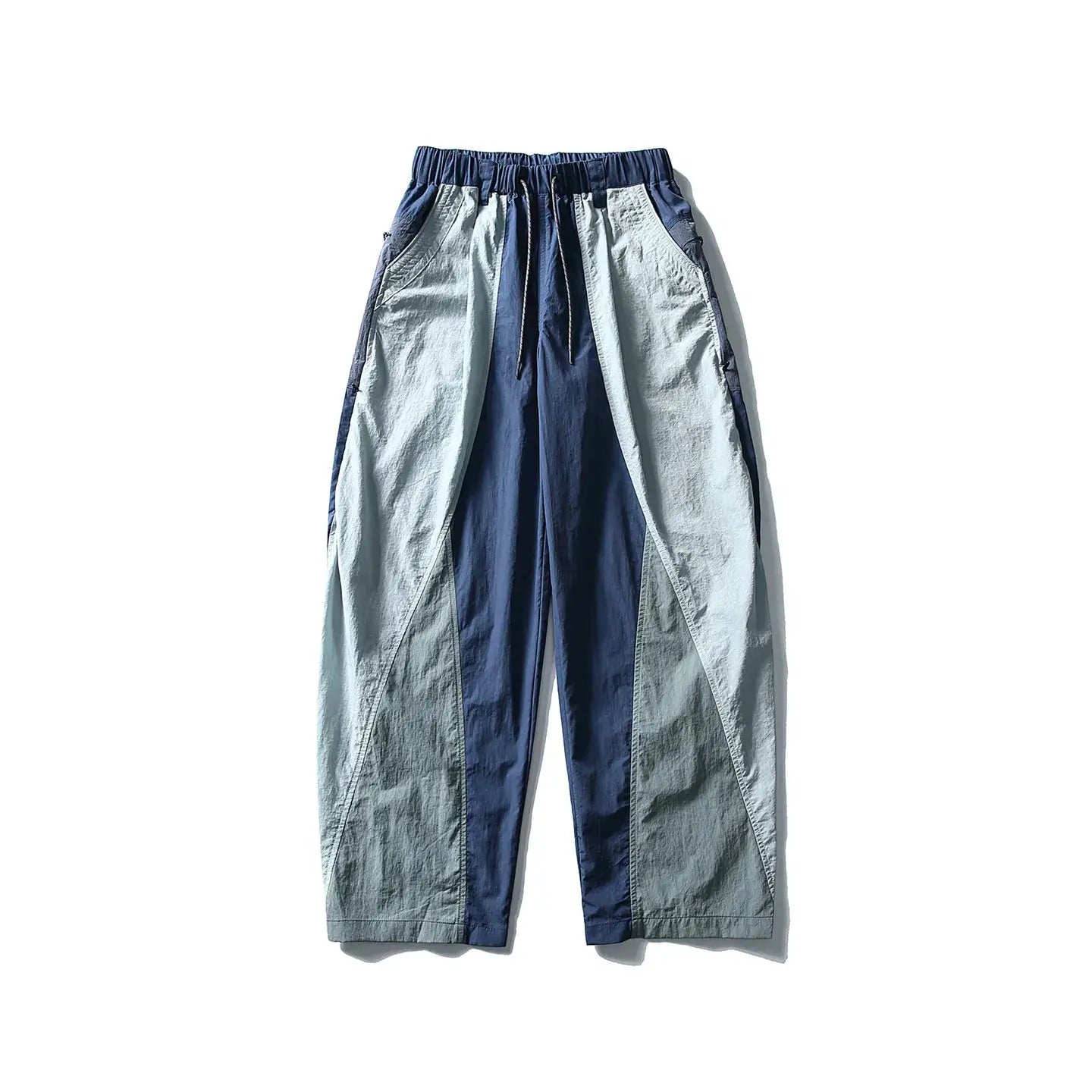 Cargo pants with two-tone light grey and navy panels, ultra-loose wide-leg, drawstring waist, techwear style.