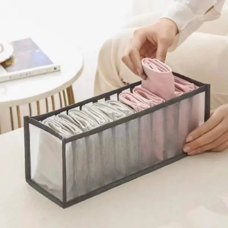 11-compartment collapsible underwear storage box with breathable gray mesh and folded underwear inside