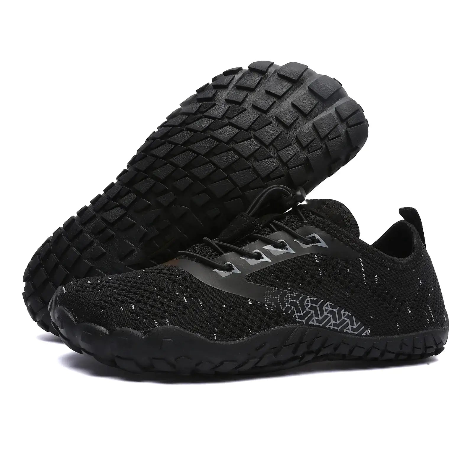 Pair of men's black trail running shoes with rugged lug outsole and knit upper.