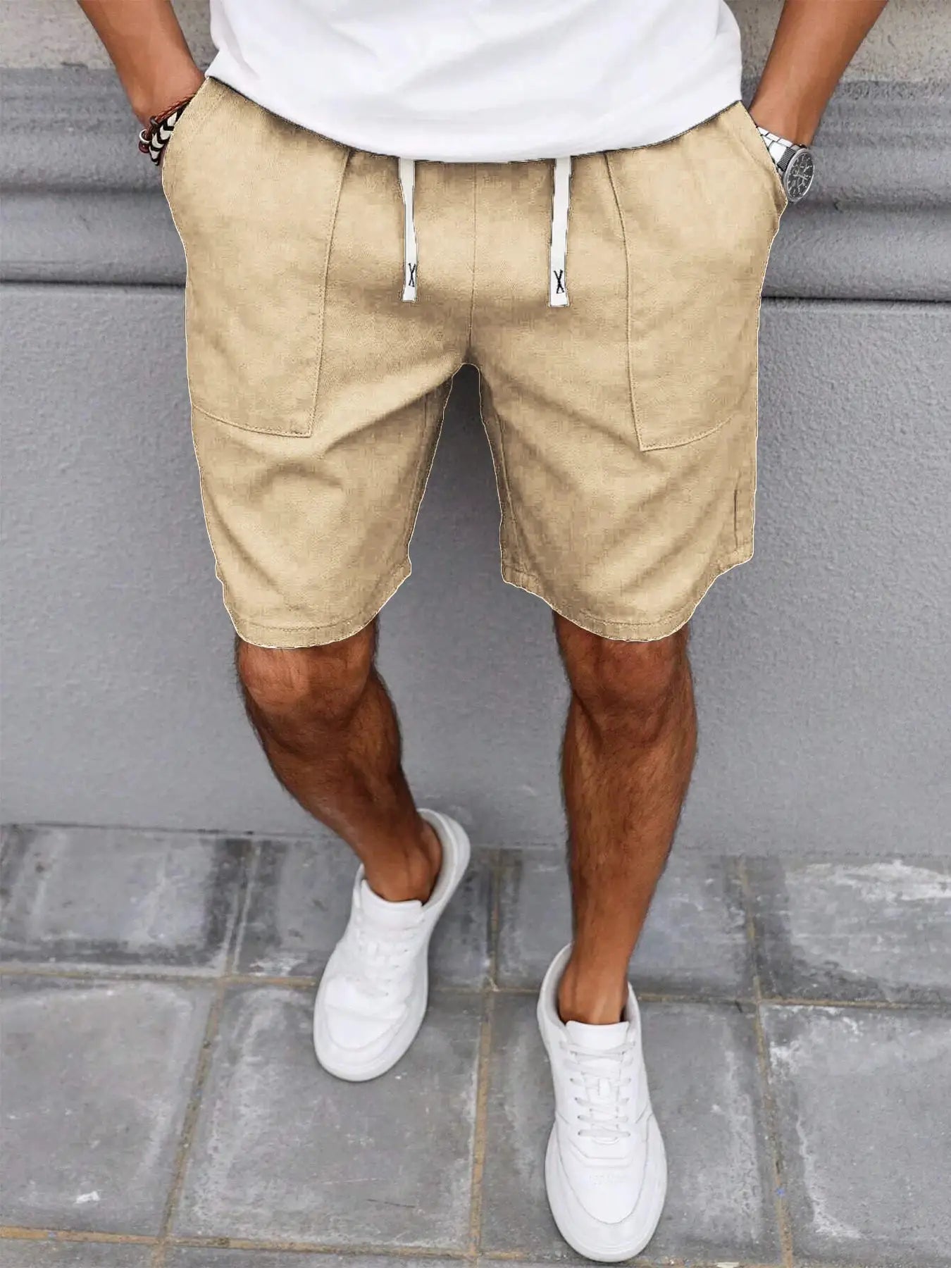 Men's beige drawstring shorts with front pockets, mid-length casual summer style.