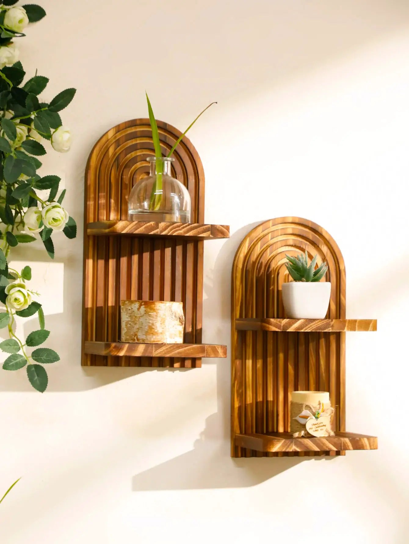 Boho style wooden arch wall shelves with natural wood finish and decorative glass vase and succulent decor
