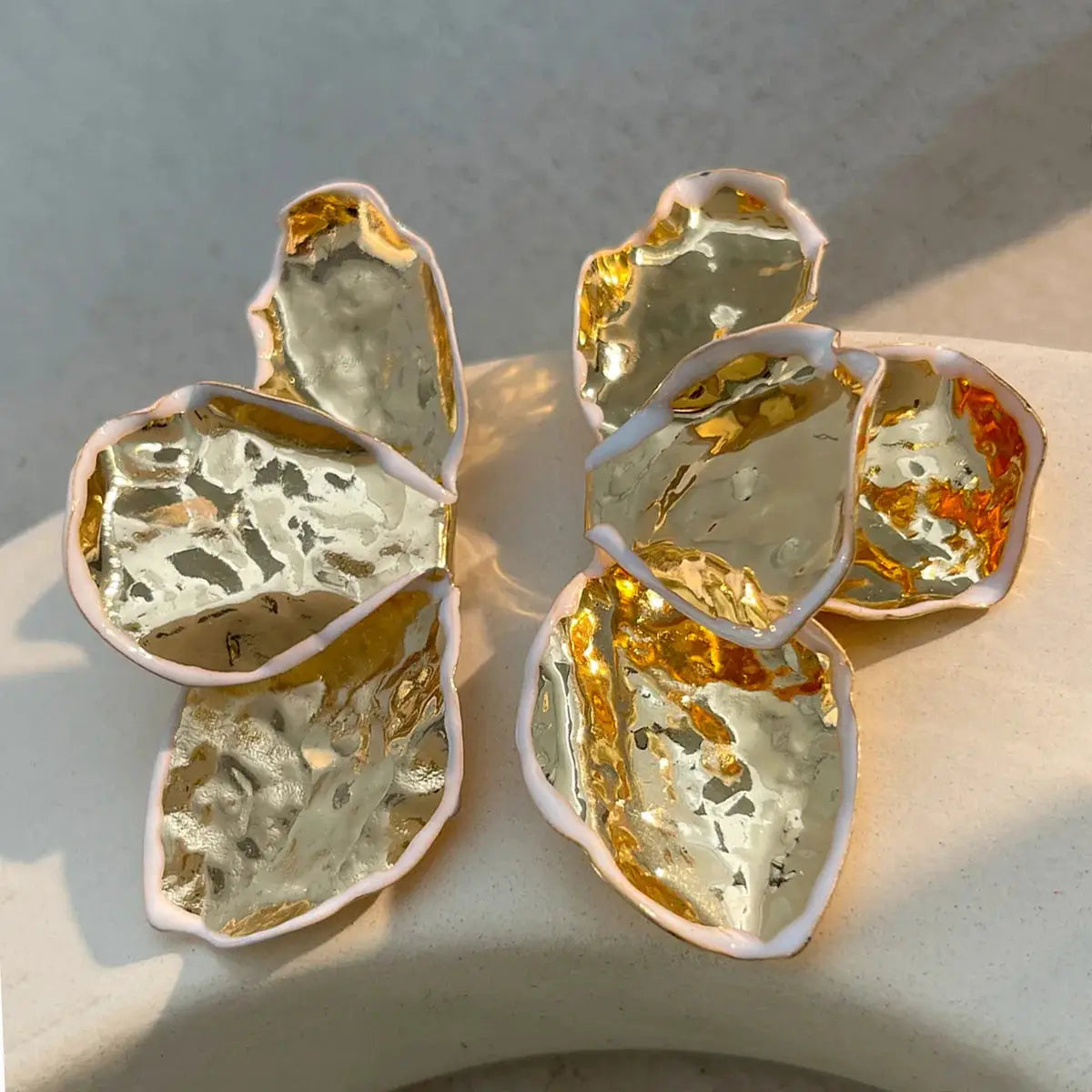 Pair of metal irregular pleated petal earrings with gold-silver foil and pink edges