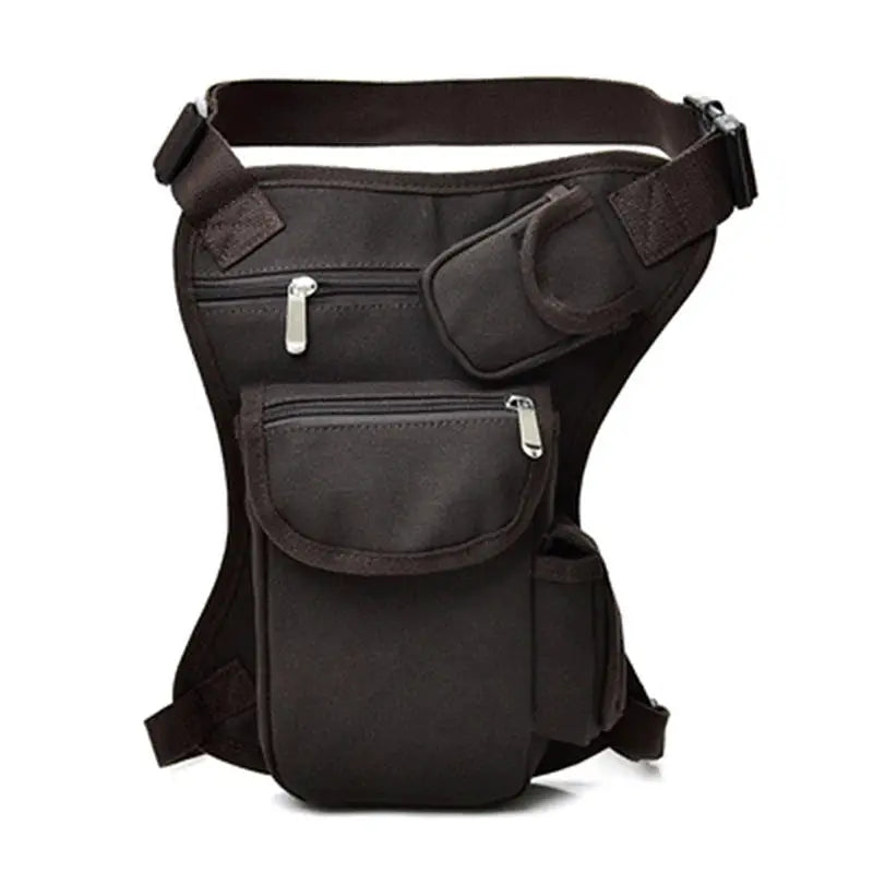 Men's black canvas drop-waist fanny pack with multiple zip pockets and belt strap