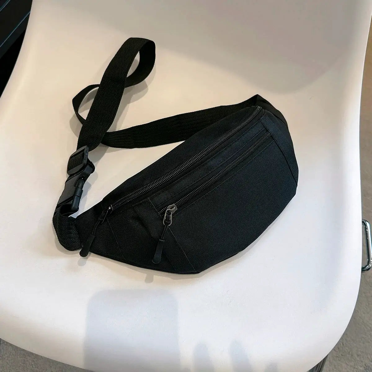 Simples Market black fanny pack waist bag with dual zippers and adjustable strap.