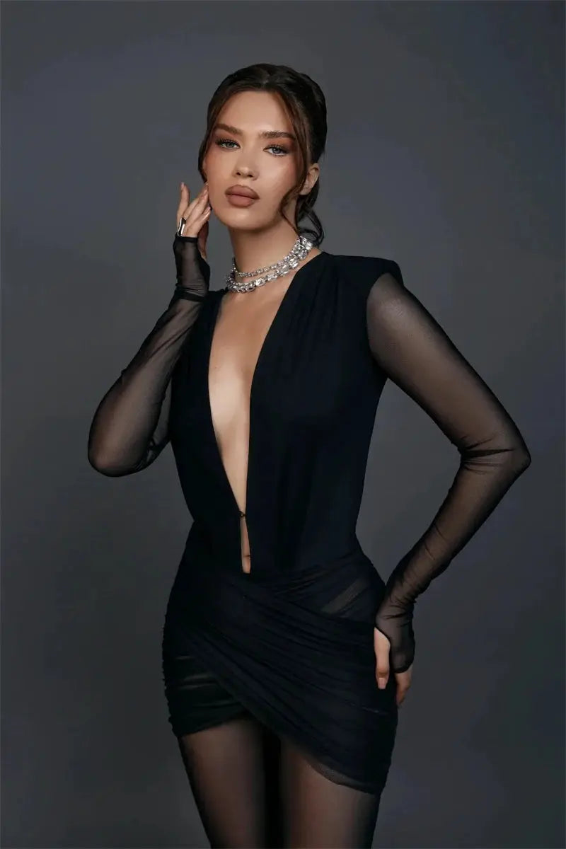 Black deep V-neck long-sleeve jumpsuit with sheer mesh sleeves and ruched wrap detail